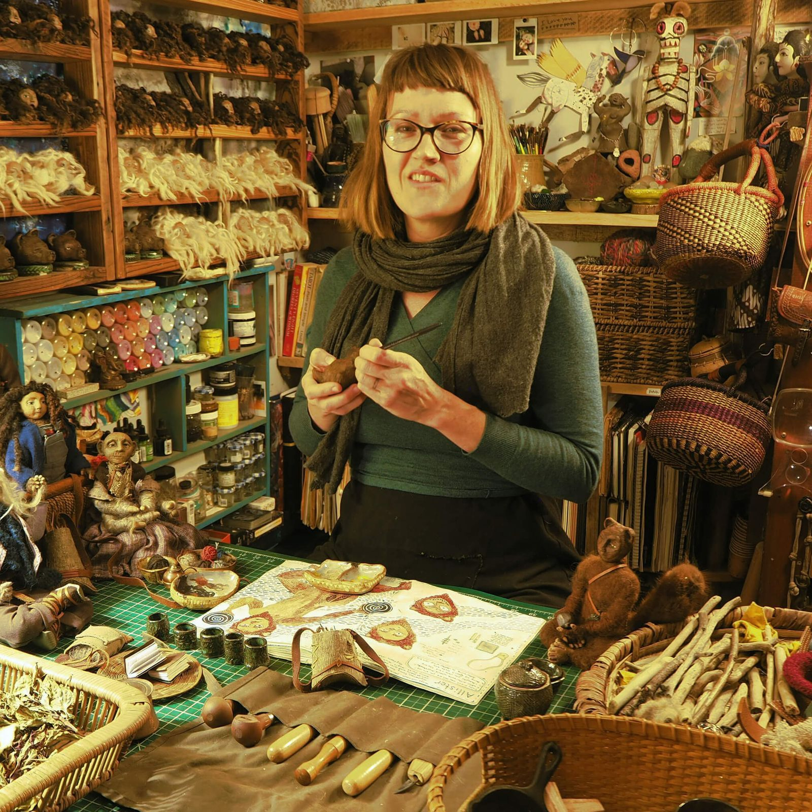 Profile image of artist working in her studio