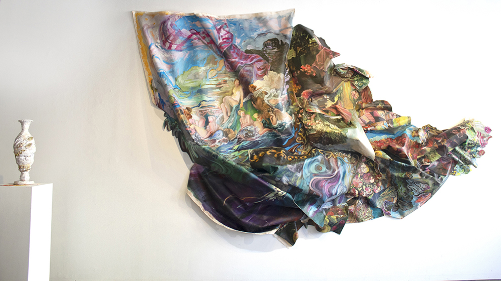 large scrunched up painting on the wall with a ceramic vessel in foreground