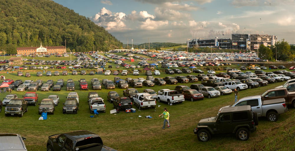 parked cars in field at motor speedway