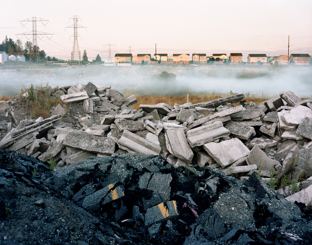 asphalt and construction rubble with lingering fog