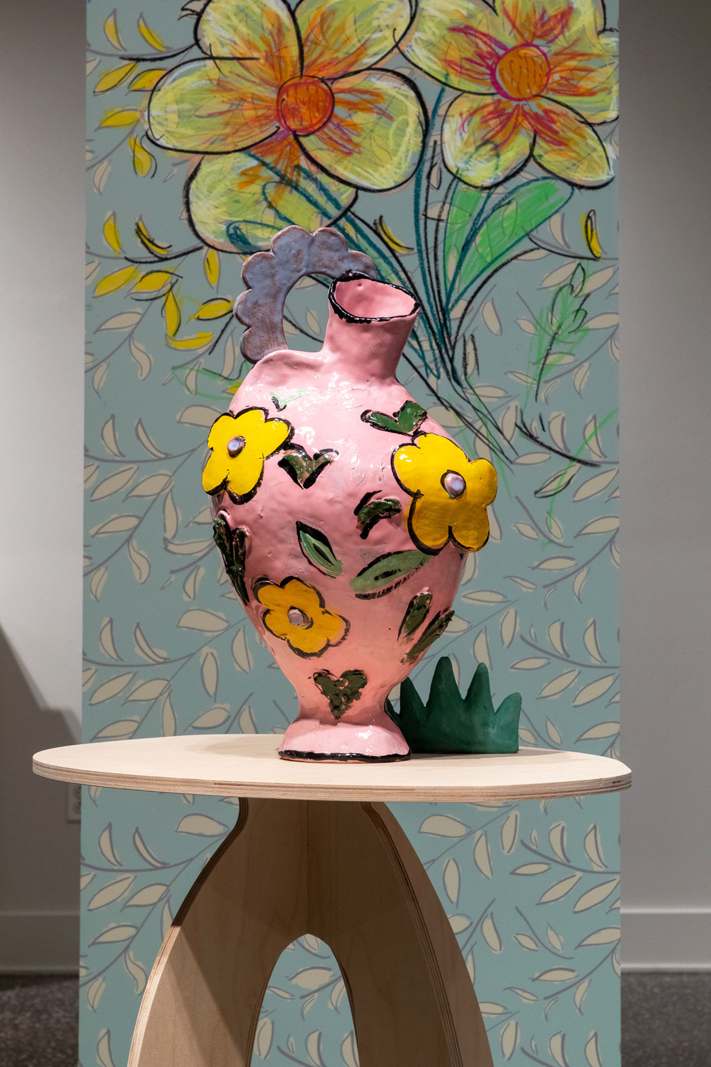 colorful ceramic vase on wooden table