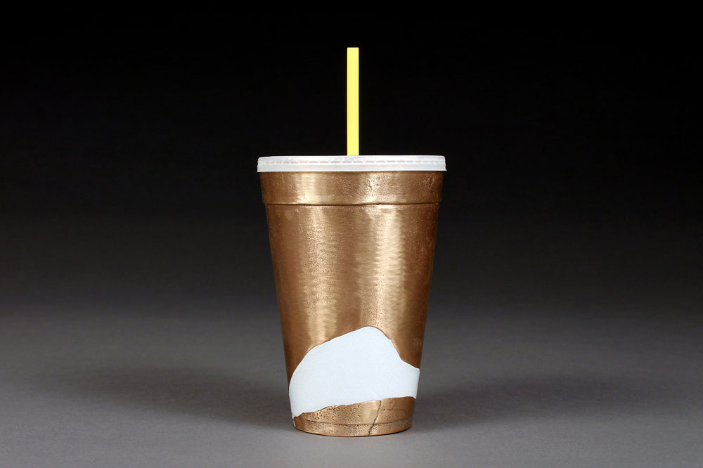 cast bronze cup with small portion of original styrofoam inserted