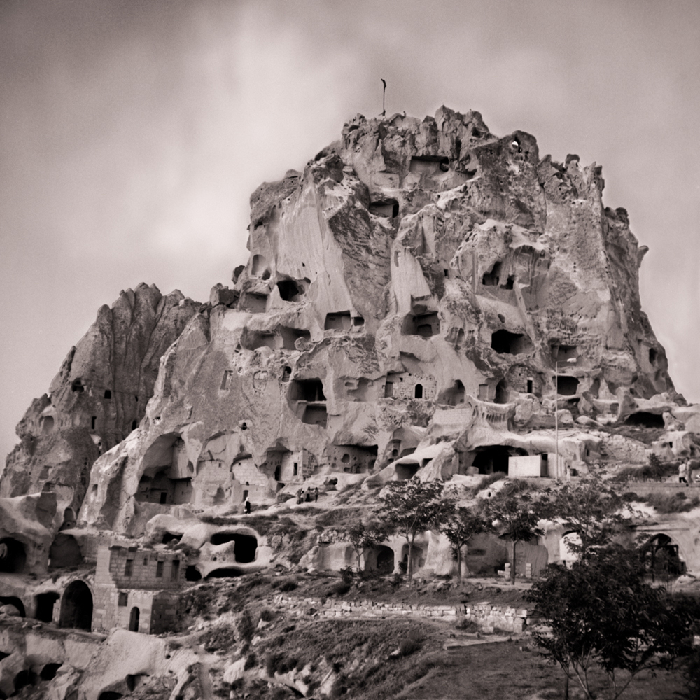 homes carved into towering mountain