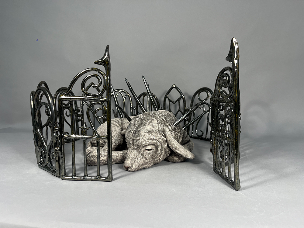 Lamb surrounded by metallic fence