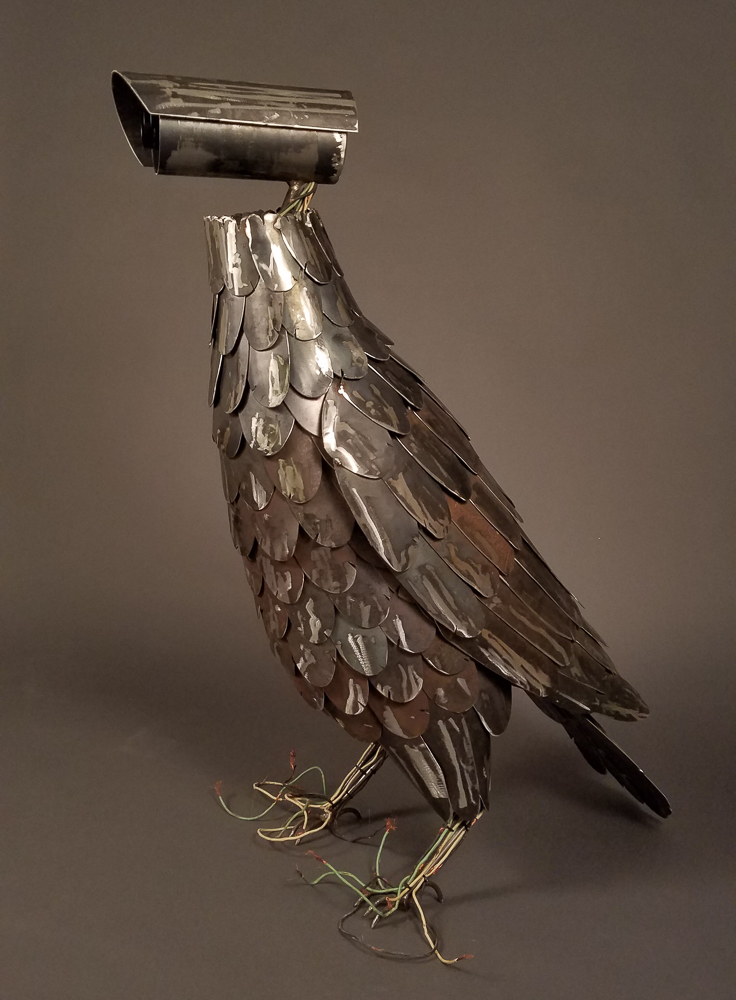 Metal bird with security camera head